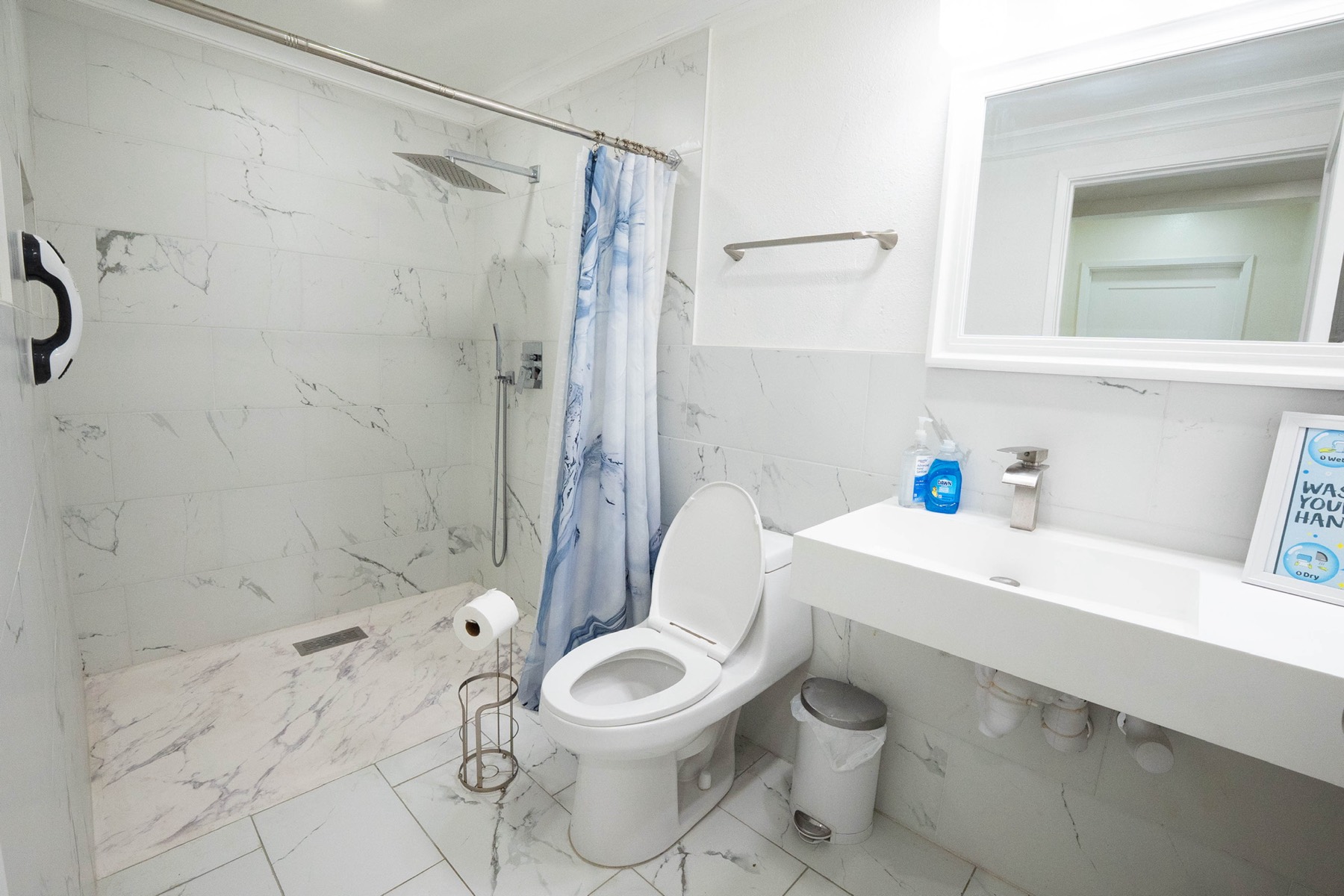 Accessible bathroom with walk-in shower and grab bar