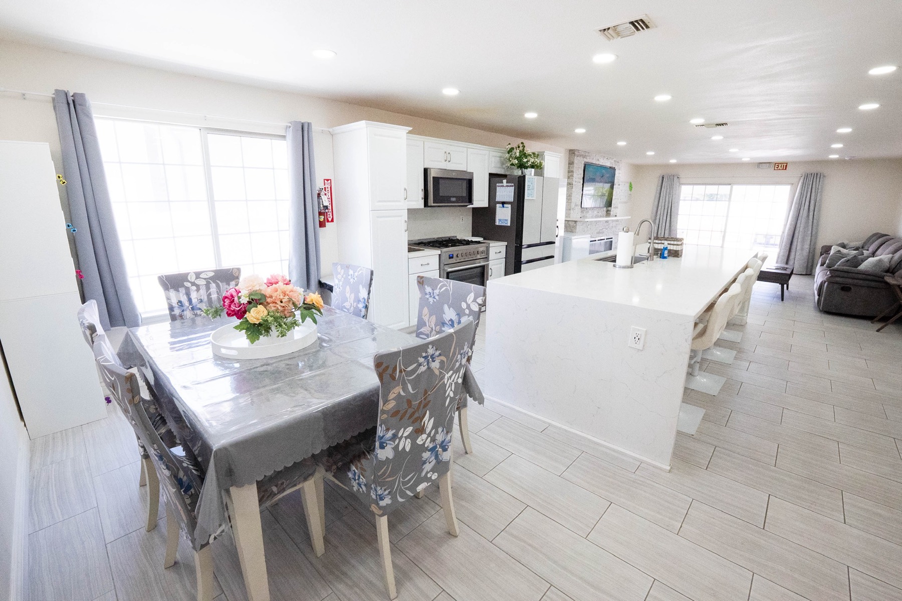 Warm shared living area with fresh flowers