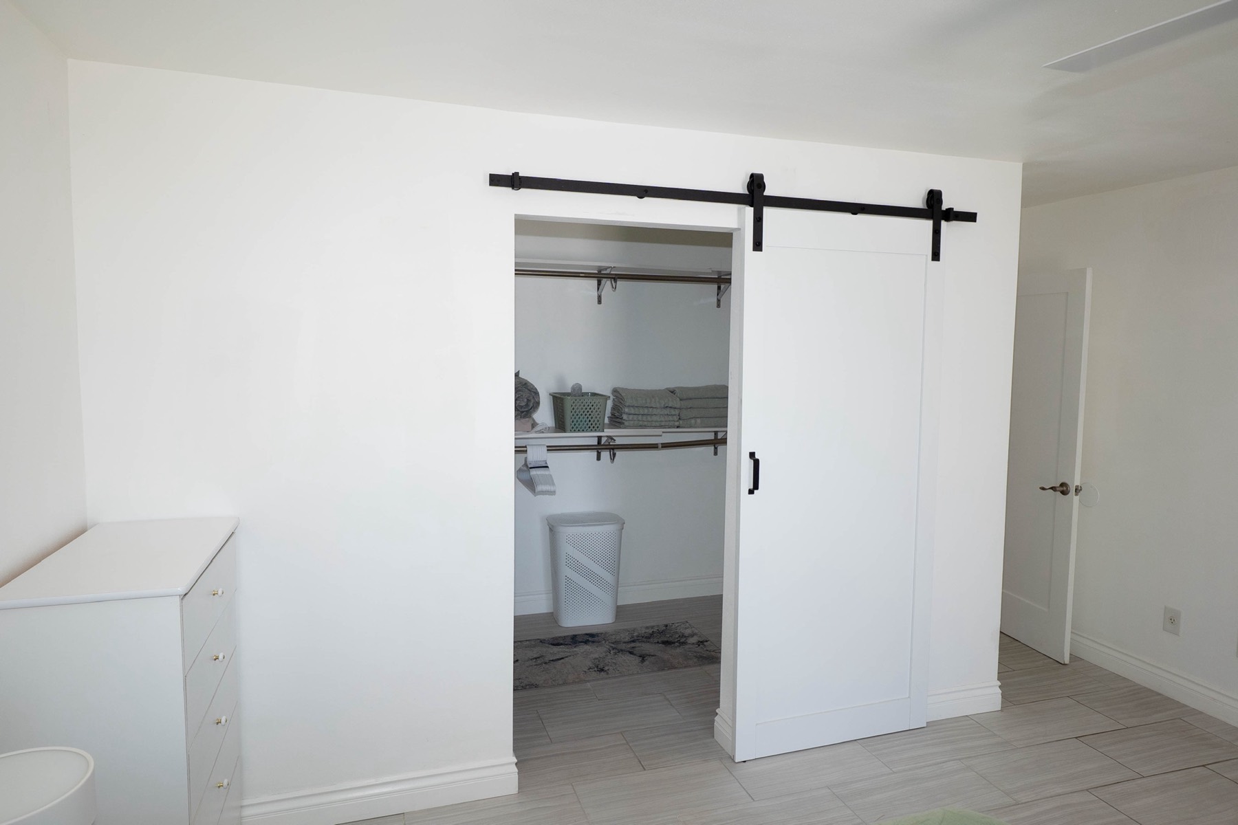 Sliding barn door detail — one of many thoughtful design touches throughout the home